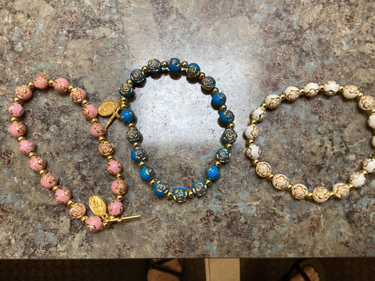 Bracelet: pink St. Therese ; teal OL of Guadalupe ; ivory Mary Queen of Heavengold rosary bracelet